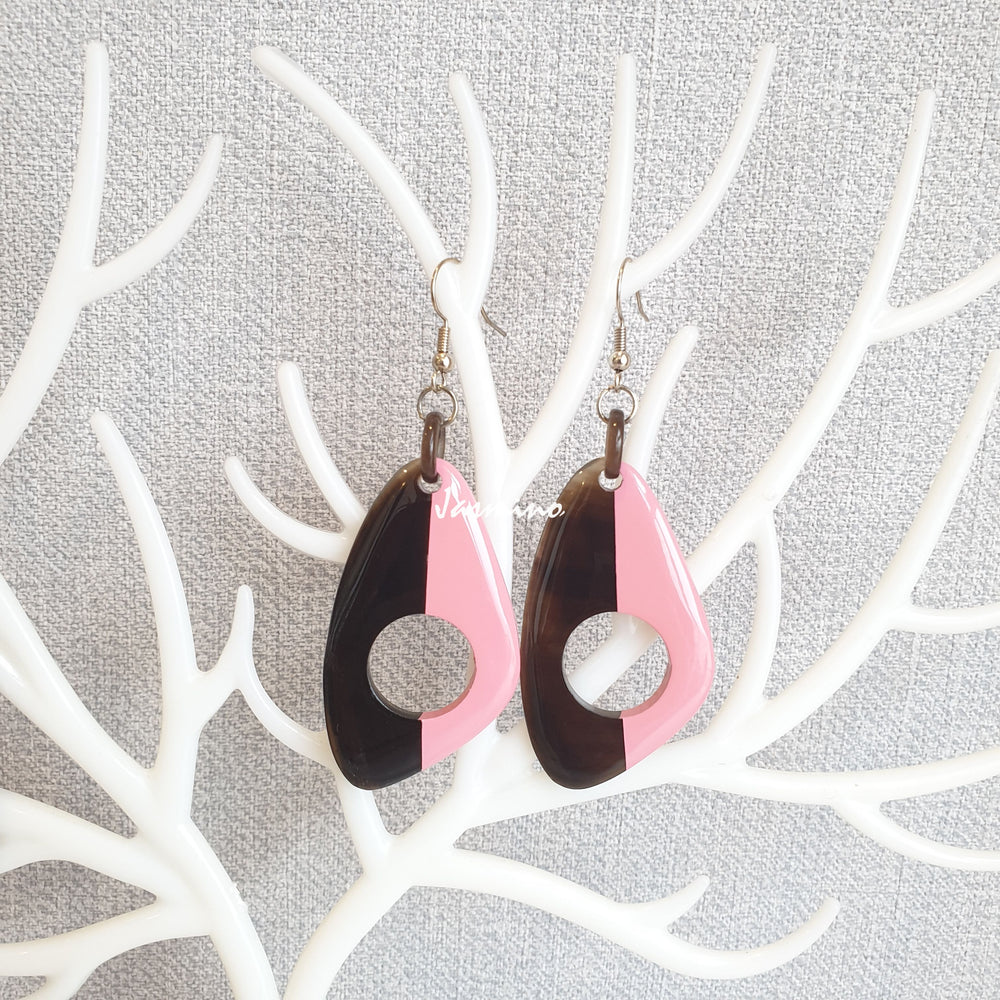 
                  
                    Unique handmade earrings with half natural horn and half painted rose quartz on the light background, impressive gift for her
                  
                