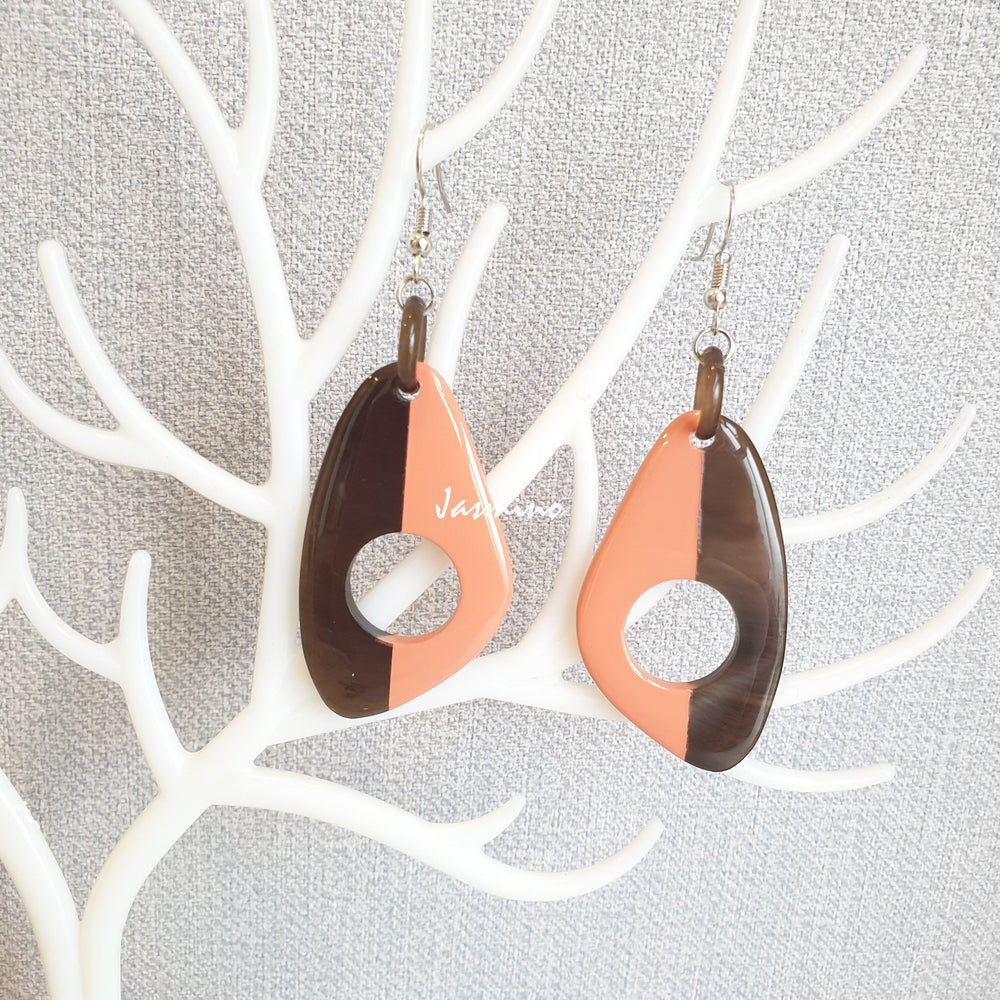 
                  
                    Unique handmade earrings with half natural horn and half painted salmon on the light background, impressive gift for her
                  
                