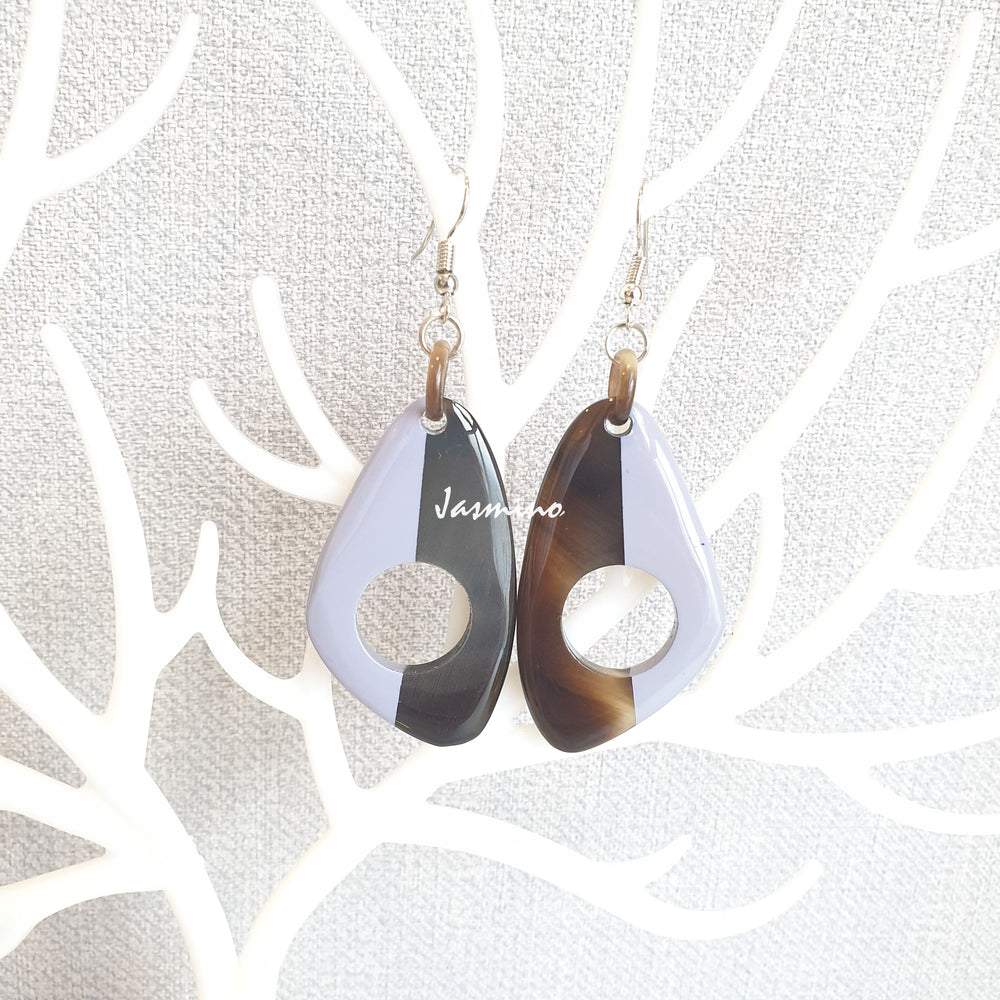 
                  
                    Unique handmade earrings with half natural horn and half painted serenity on the light background, impressive gift for her
                  
                