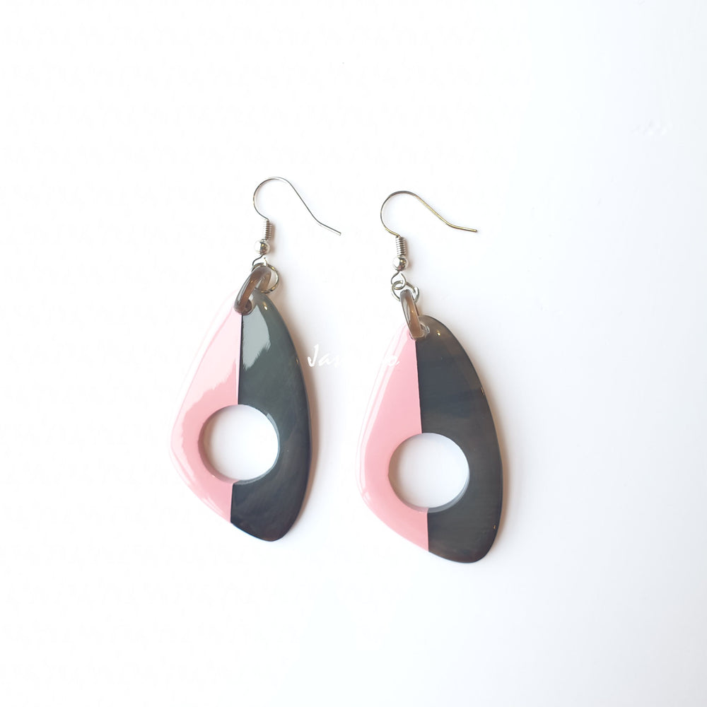 
                  
                    Unique handmade earrings with half natural horn and half painted rose quartz on the light background, impressive gift for her
                  
                