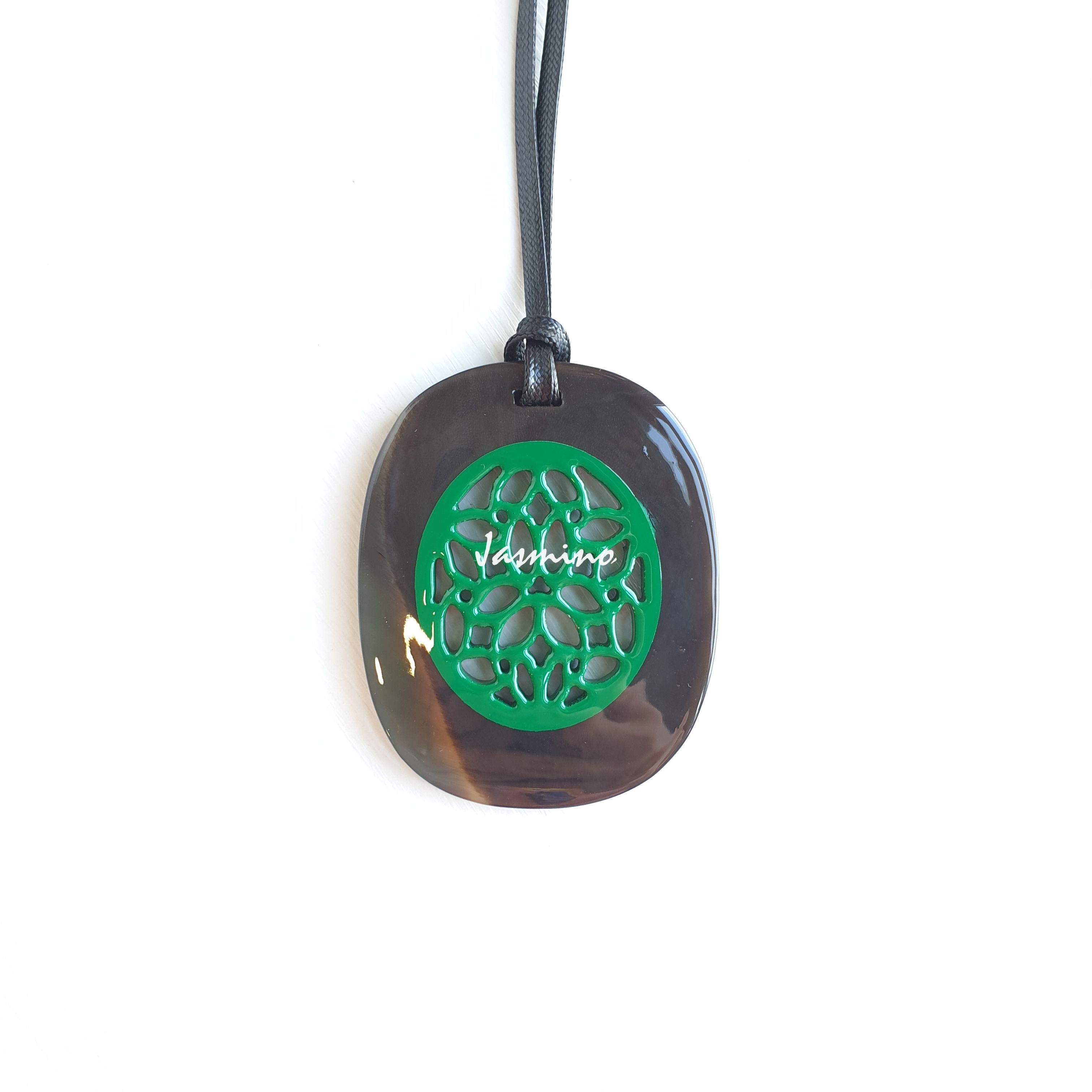 elliptical green horn pendant on the light background, impressive gift for her