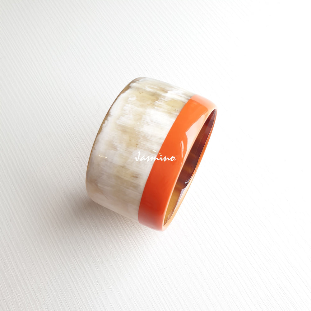 
                  
                    orange peel  lacquer bracelet on the light background, impressive gift for her
                  
                