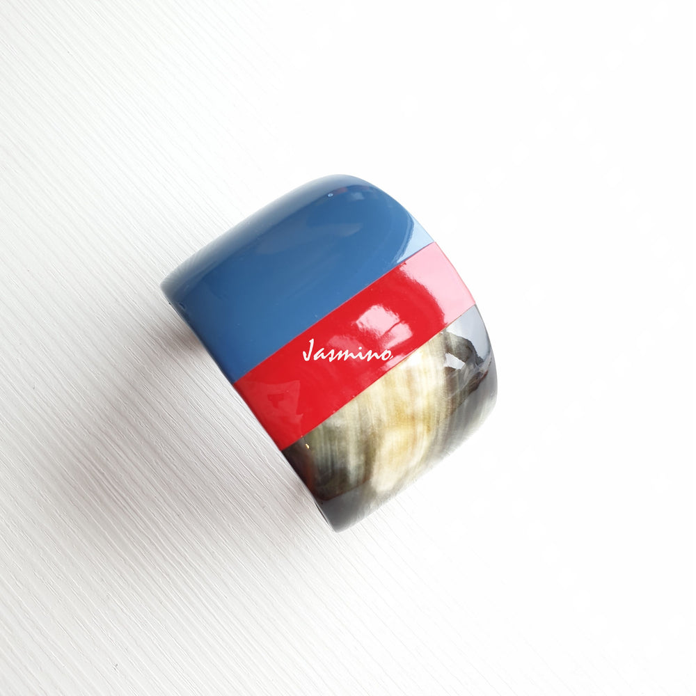 
                  
                     scarlet- classic blue lacquer buffalo horn bracelet on the light background, impressive Christmas gift for her
                  
                