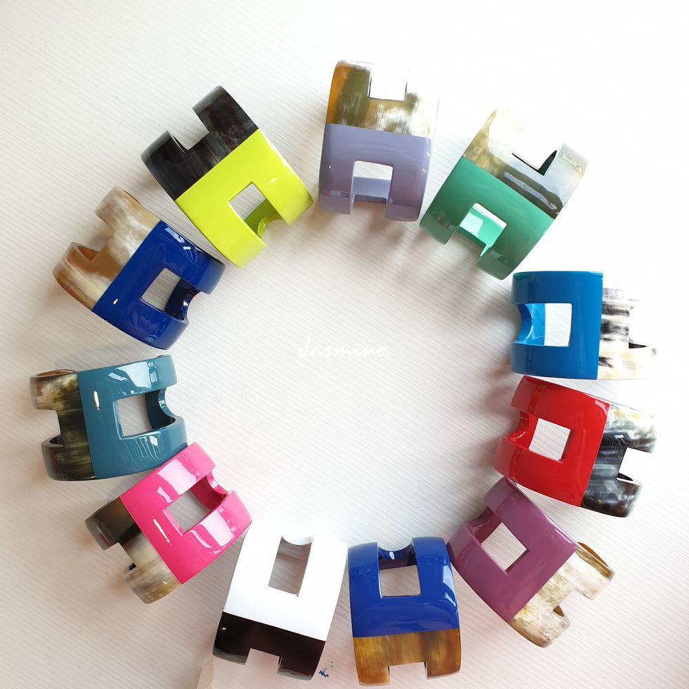 
                  
                    A set of handmade cuff bracelets includes a variety of colors namely  red, orange, yellow, green, blue, indigo and violet 
                  
                
