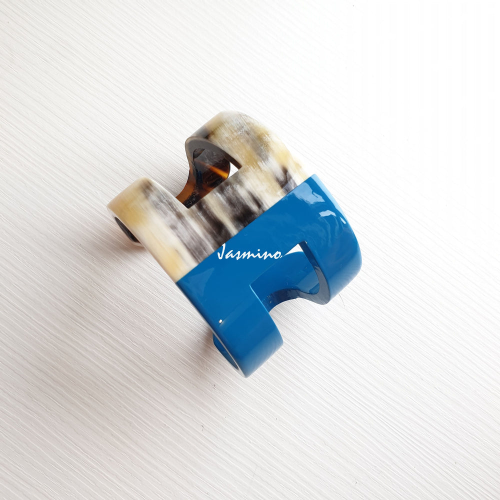 
                  
                    A cuff bracelet is designed by a blue and brown color and made by natural buffalo horn for a unique gift
                  
                