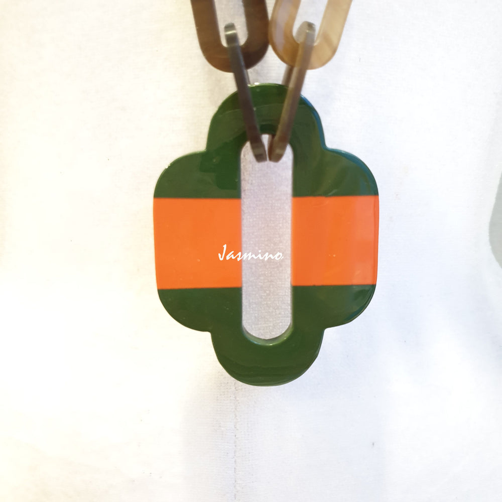 
                  
                    lacquer buffalo horn necklace with trendy orange green natural horn pendant in natural light
                  
                