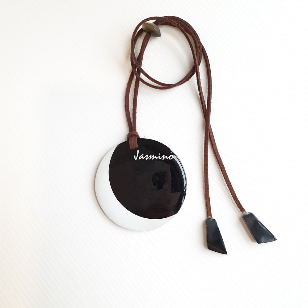 
                  
                    Unique round pendant with a combination of black and white, impressive gift for your friend
                  
                