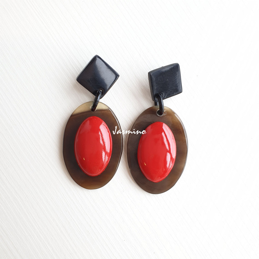 
                  
                    Jasmino unique handmade Bohemian mermaid beach oval drop earrings feature red and brown made of natural buffalo horn
                  
                