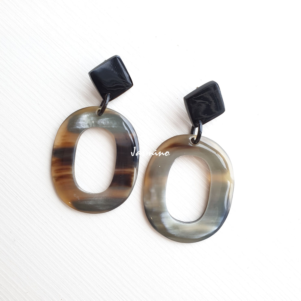 
                  
                    Jasmino unique handmade large oval drop earrings feature a light colour made of natural buffalo horn
                  
                
