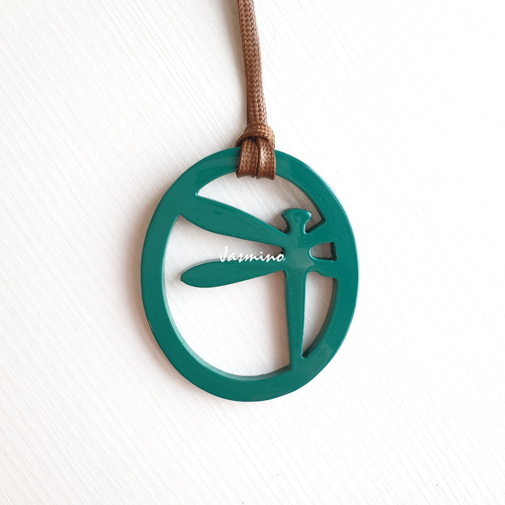 
                  
                    elliptical teal lacquer pendant with dragonfly pattern inside on the light background, impressive gift for her
                  
                