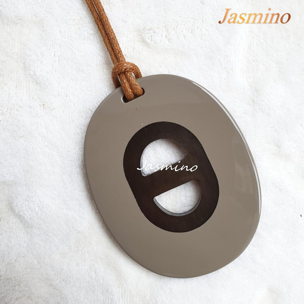 
                  
                    Jasmino unique handmade alphabet letter D pendant features ash in natural buffalo horn
                  
                