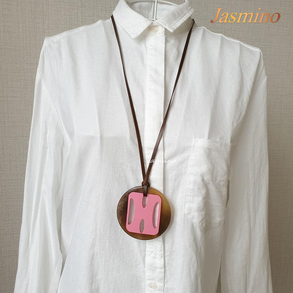 
                  
                    Jasmino unique handmade H pendant features pink in natural buffalo horn for Christmas gifts
                  
                