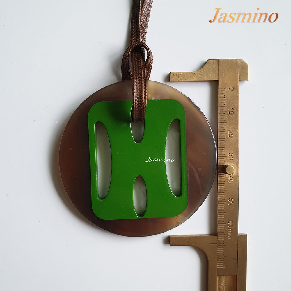 
                  
                    Jasmino unique handmade H pendant features green in natural buffalo horn for Christmas gifts
                  
                
