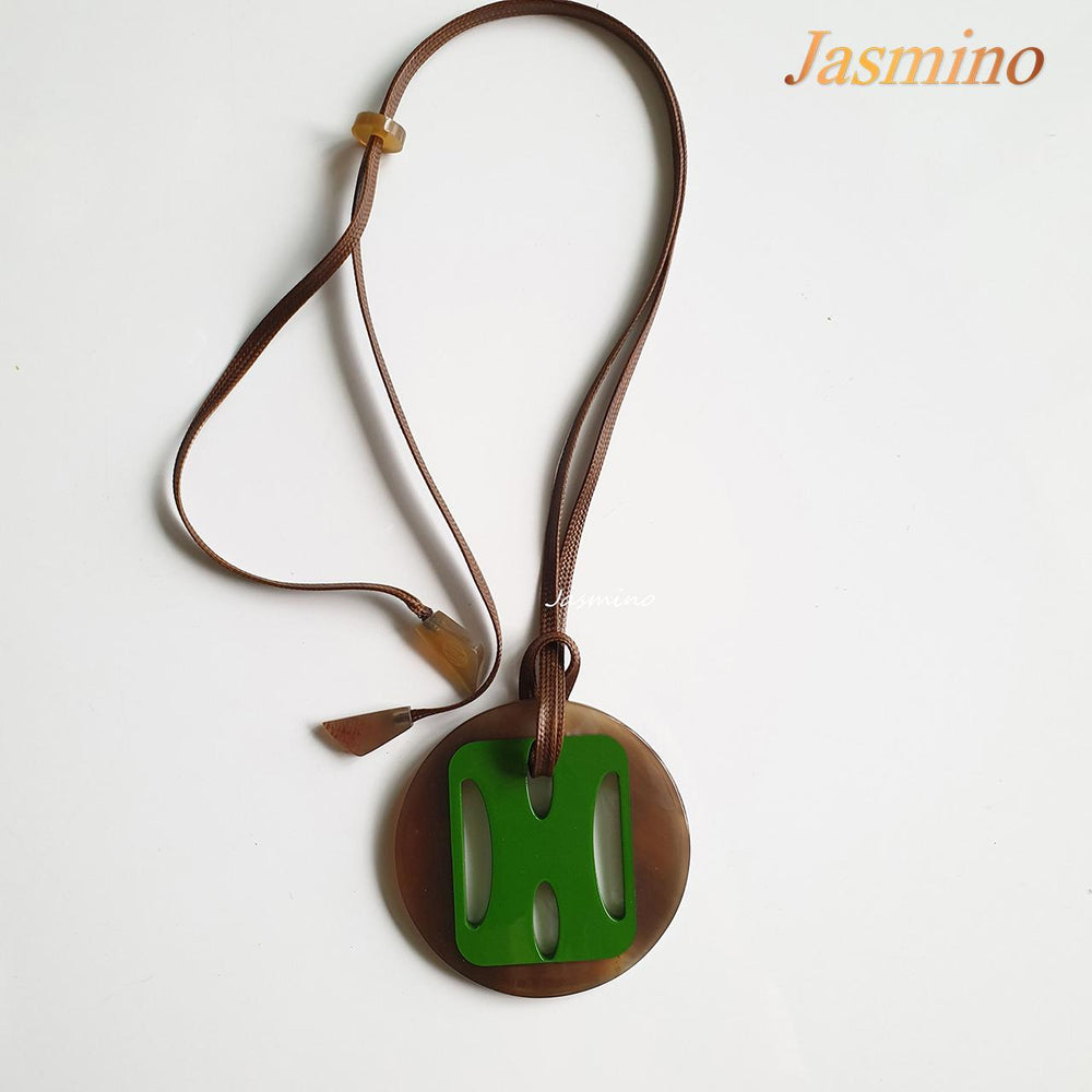 
                  
                    Jasmino unique handmade H pendant features green in natural buffalo horn for Christmas gifts
                  
                
