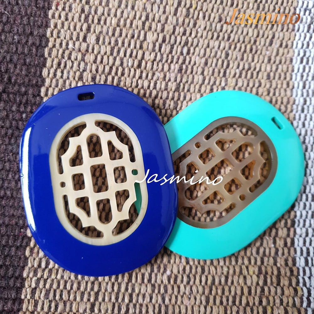 
                  
                    Two unique handmade oval pendants feature blue and turquoise that are made of natural buffalo horn for Thanksgiving gifts
                  
                