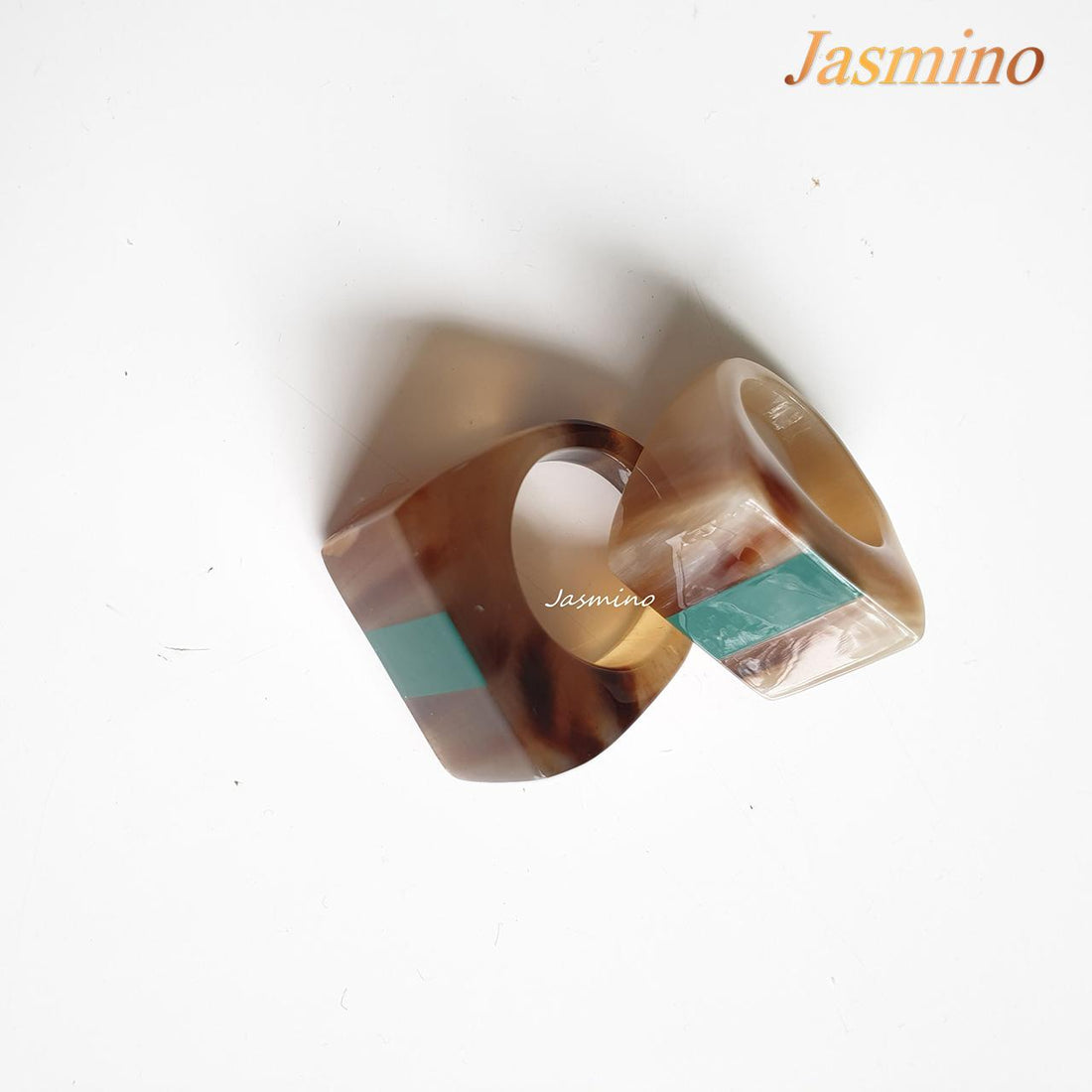 Jasmino natural horn ring on the light background, unique gift for your friend
