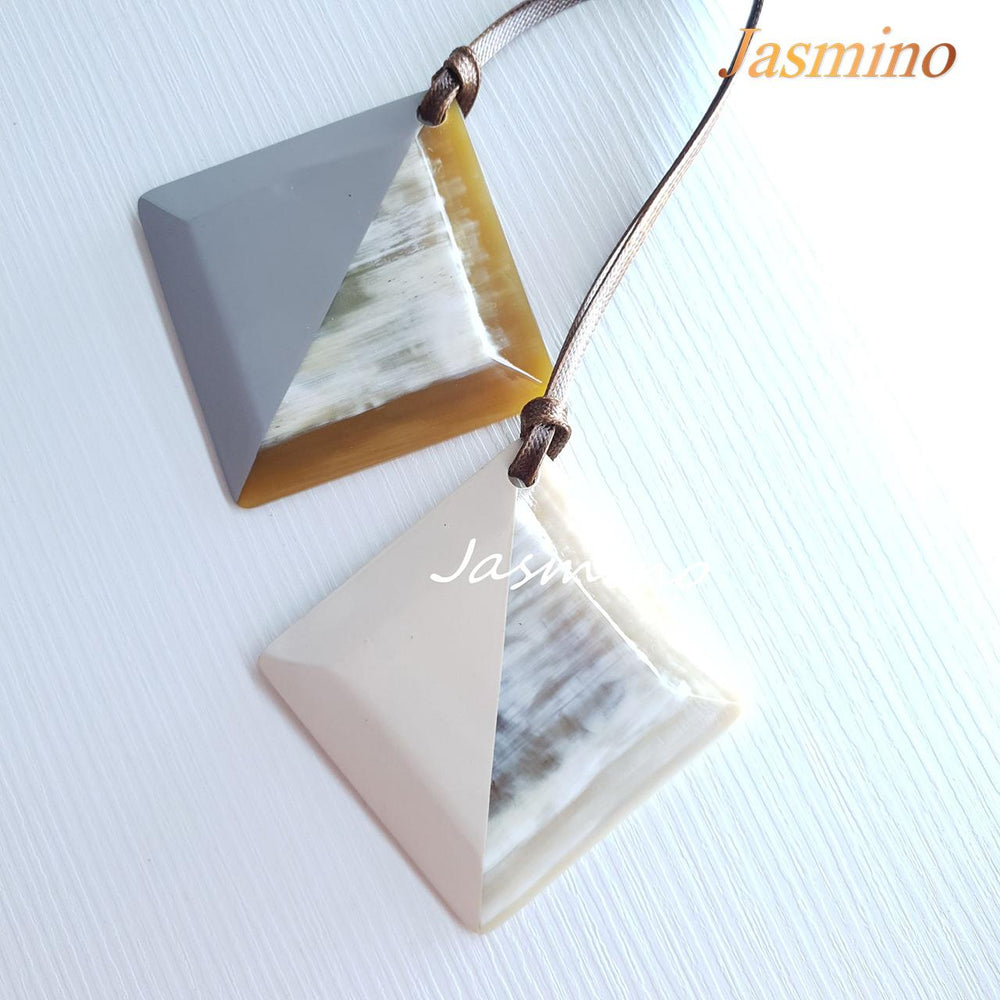 
                  
                    Two unique handmade Vintage lozenge pendants feature bright colours in natural buffalo horn for women's gifts
                  
                