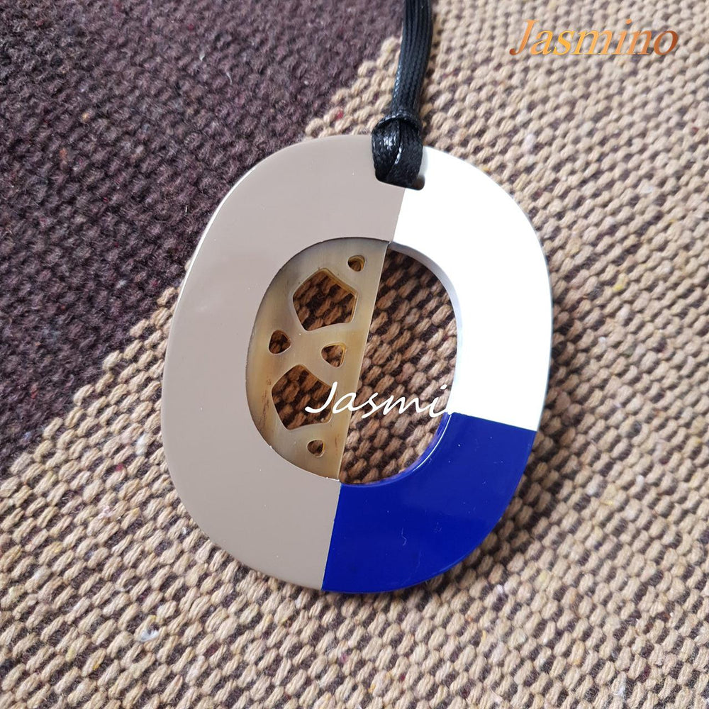 
                  
                    trendy buffalo horn pendant is painted in three colors: taupe, classic blue and brilliant white in natural light, an impressive gift for her
                  
                